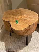 Full view of live edge wood side table showing top surface and legs