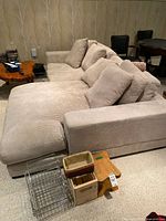 Full view of sectional showing chaise configuration and cushions