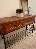 Full view of wood sofa table with two drawers and wire shelf