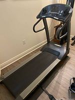 Side view of Vision Fitness Premier treadmill showing running belt and frame