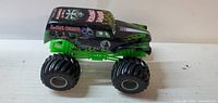 Side view of Grave Digger monster truck toy showing detailed body and large tires