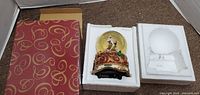 San Francisco Santa snowglobe in original red and gold box with styrofoam protection.