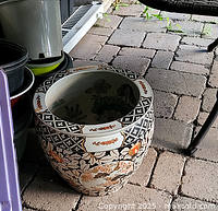 Full exterior view of ceramic planter showing floral and geometric patterns