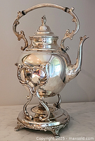 Full frontal view of kettle mounted on stand