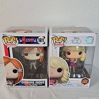 Front view of both Funko Pop boxes showing Orihime Inoue and Sharpay figures inside.