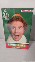 Front view of sealed box showing Buddy the Elf character and game title.