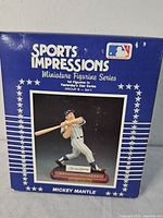 Front of box showing Mickey Mantle figurine and branding information.