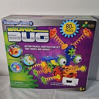 Front of the boxed Techno Gears Bionic Bug Playset showing colorful bug model, 80+ pieces, and STEM branding