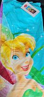Full view of Tinkerbell beach towel showing main character print