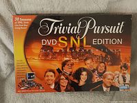 Box front of Trivial Pursuit DVD SNL Edition featuring 30 seasons of SNL trivia with cast images and branding
