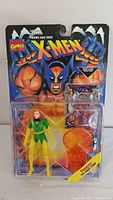 Front photo of new in box X-Men Phoenix Saga Series Phoenix action figure showing bright character art and figure in yellow and green.