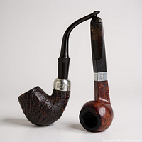 Two Peterson briar pipes showing bowl finishes and sterling bands
