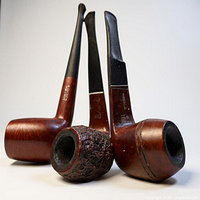 Front angled view of all three pipes standing upright showing bowl styles and stems