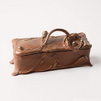 Top and side view of bronze-tone Art Nouveau jewelry casket with floral handle