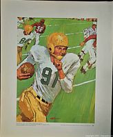 Football action print with player #91 and trailing defenders