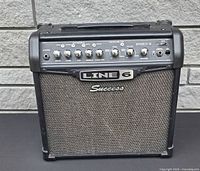 Front view showing grille, logo and overall cabinet