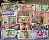 Overview of entire assortment of world banknotes laid out in box