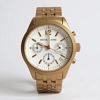 Front view of gold-tone Michael Kors chronograph wristwatch showing dial, bezel, bracelet