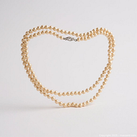 Entire strand of cream pearls with clasp visible