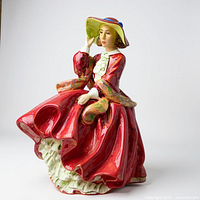 Front view of figurine showing full gown and pose
