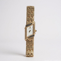 Front view of Seiko asymmetrical rectangular wristwatch showing dial, diamond-set bezel and full bracelet