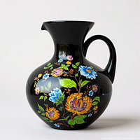 Front view of Ardalt black floral pitcher showing full floral pattern and shape