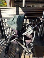 Side view of stroller with toddler seat attached