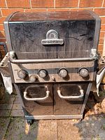 Full front view showing hood, control panel, cabinet doors and wheels