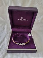 Charriol bracelet in purple Charriol box showing bracelet on velvet cushion