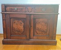 Full front view showing marble top, drawer, doors, overall condition