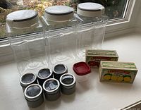 overall view of all 12 containers on windowsill