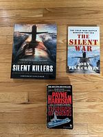Front covers of all three submarine books