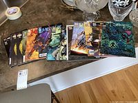 Comic books displayed on table, showing full lot amount and condition