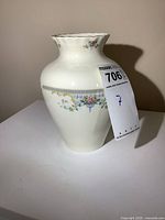 Front side view showing floral and geometric decoration with auction tag