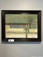 Framed painting showing a winter railway crossing scene with train cars, signed by artist A. Lanceman.