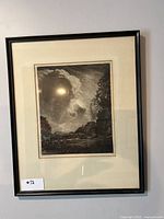 Framed mezzotint print showing a cloudy sky over a natural landscape with trees and figures.