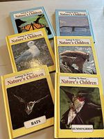 Front covers of six books in the Nature's Children series showing animals like bats, hummingbirds.