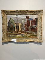 Full view of oil painting showing industrial buildings with detailed ornate frame.