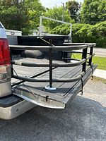 Bed extender mounted on the tailgate of a Toyota Tundra pickup showing its overall structure and fittings.
