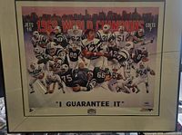 Full framed lithograph showing the 1969 NY Jets team celebrating their championship with city skyline in background and bold title text.