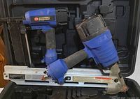 Two Campbell Hausfeld pneumatic nailers inside a black carrying case, displaying the framing nailer and the brad nailer/stapler side-by-side.