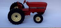 Side view of the International diecast tractor model showing the left side with clear branding and model details