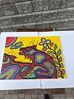 Front view of the painting on white display boards outdoors