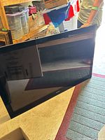 Front angled view of the 52 inch Sony LCD TV on floor showing full screen and bezel.