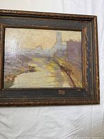 Front view of framed oil painting on wood panel depicting canal landscape