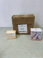 Shows the box of professional gel polish, the small beige gel polish box, and the UV nail lamp retail box.