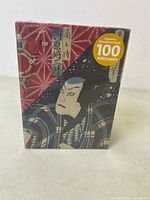 Sealed boxed set showing traditional Japanese woodblock print artwork on the cover with text '100 Postcards'. The box is new and unopened.