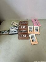 All items grouped on table showing variety of false eyelashes sets.