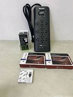 Lot layout showing Huntkey power strip, boxed smart dimmer, two BF-A4X20 fans, two Samsung HDMI cables