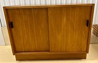 front view showing sliding doors and handles